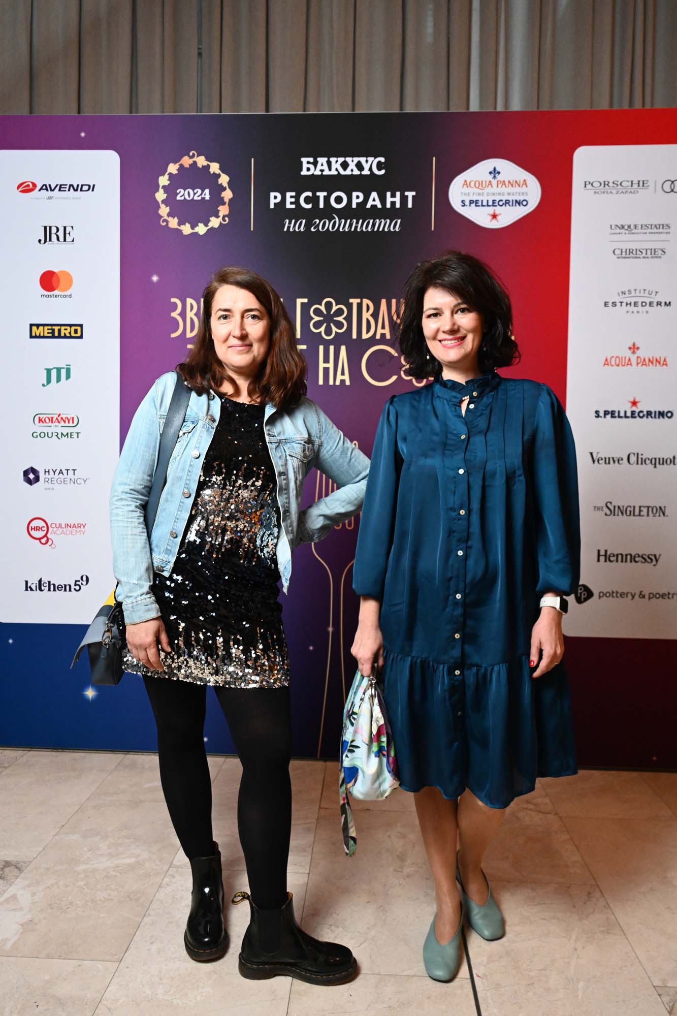 Two women at the Bacchus Restaurant of the Year awards, for which the studio made the award plates