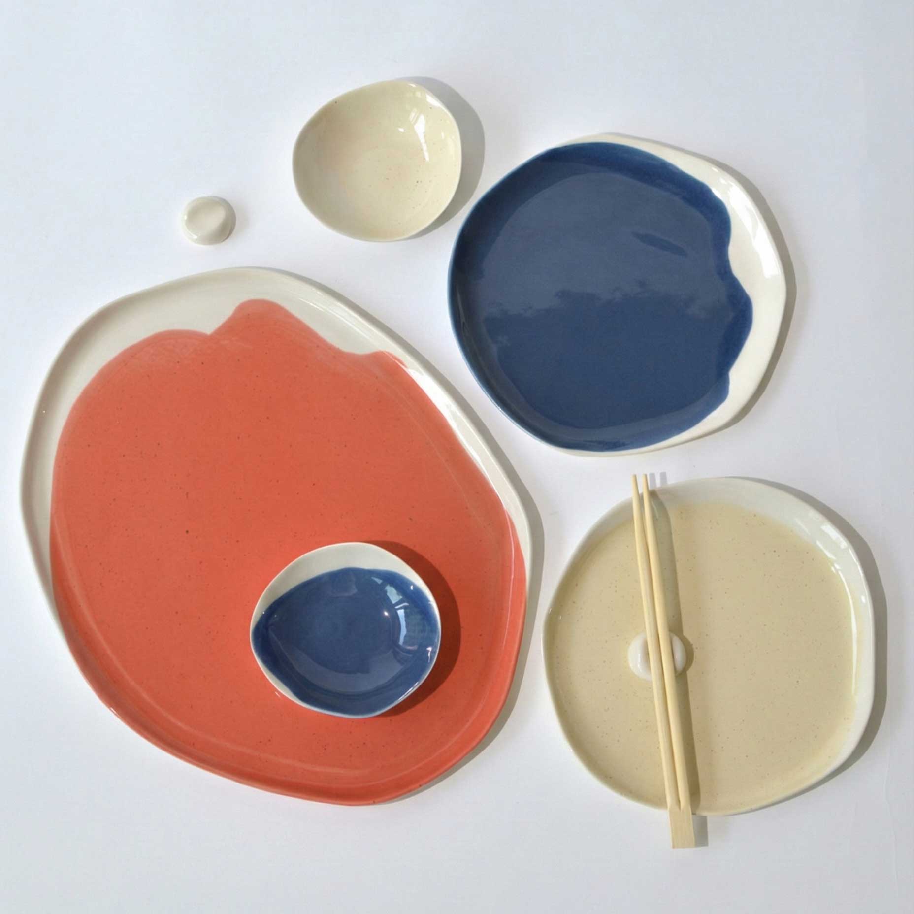 Coral and Dark Denim handmade porcelain plates and bowls with chopsticks from the 2026 palette